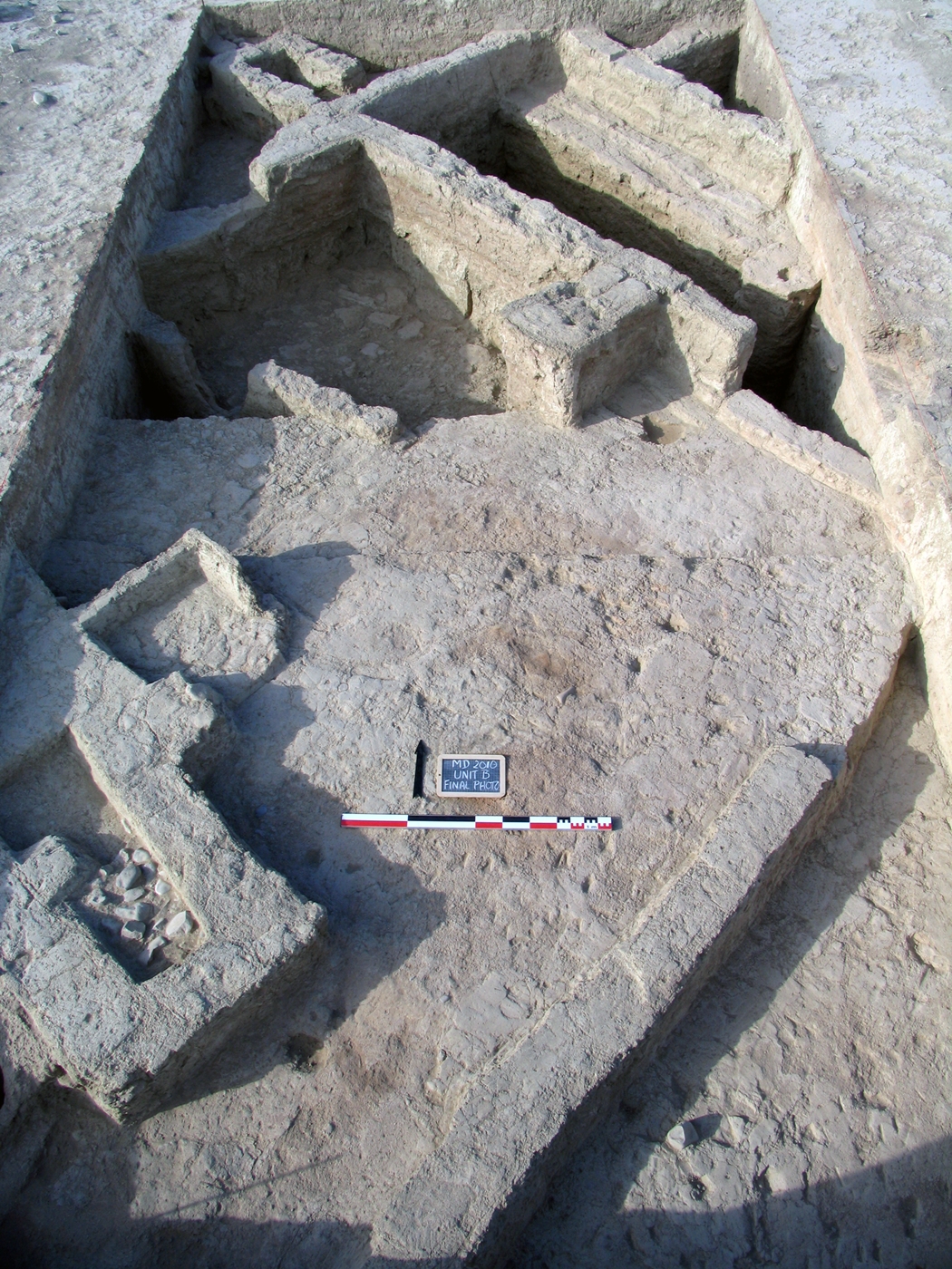 House 4 viewed from the south. In the back portion of the main room the bricky debris that accumulated between the earlier and later phases of the house’s occupation is visible.