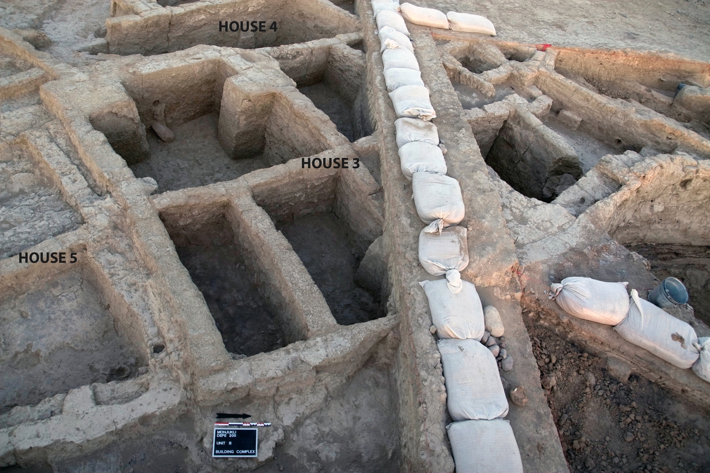 Overview of adjacent houses in Units B and D. Note that in the later phase of House 3, visible here, the original single room was divided into seven small cubicles by means of partition walls.