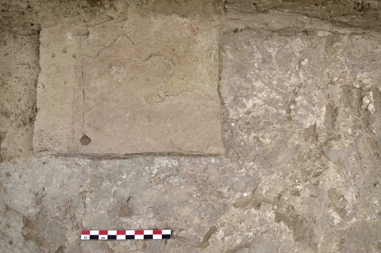 View of a plaster floor showing multiple replasterings. The latest one was red, whereas the earliest one visible here was plastered white.