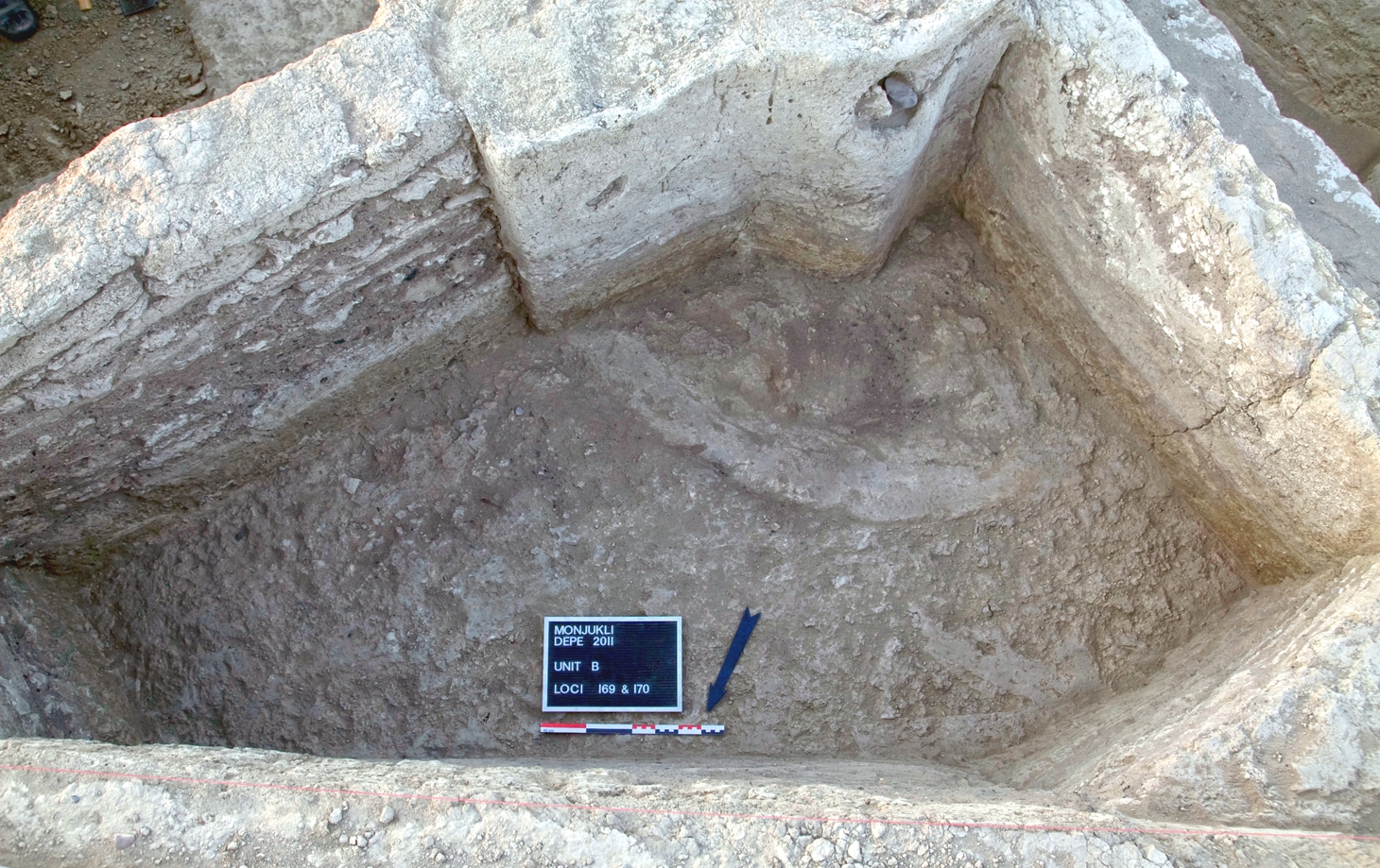 An unusual, chimney-like structure, FI 17, constructed up against a buttress in House 3. The chimney was most likely in use in a brief phase of abandonment before the house was renovated and partition walls added.