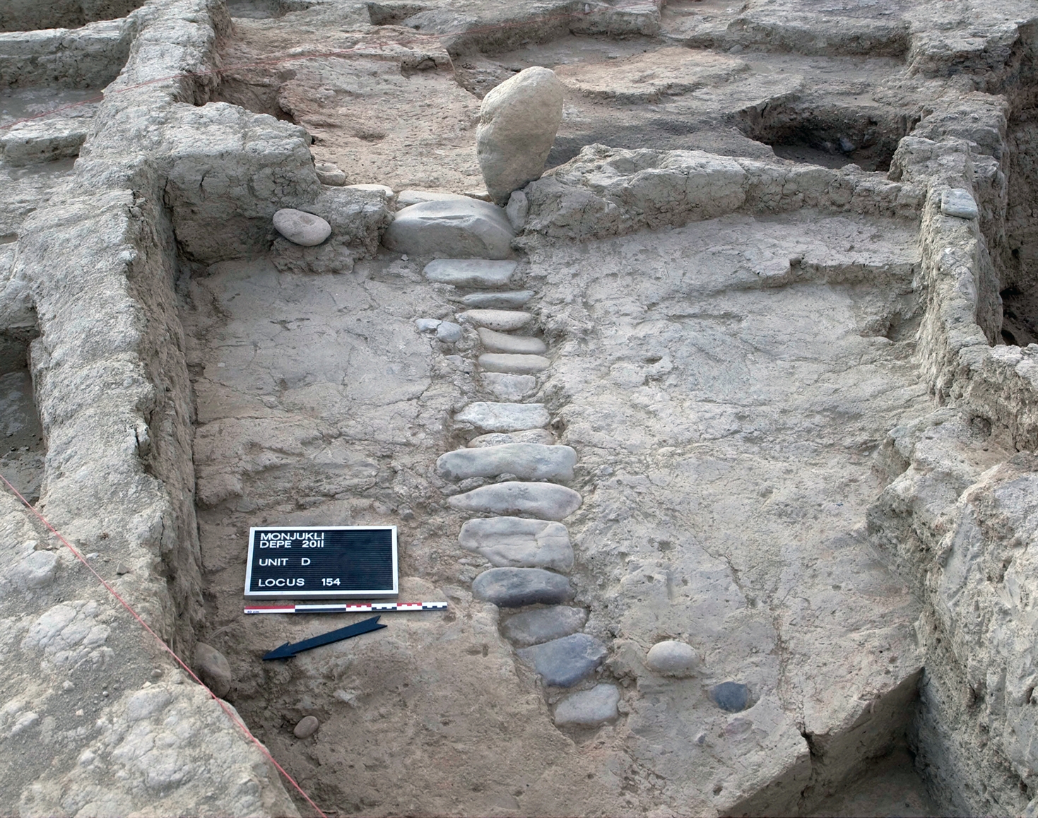 Gate 1 at the end of Berdiev Street. In one phase of its use, the street was partially paved with stones. Behind the gate lies the Eastern Midden.