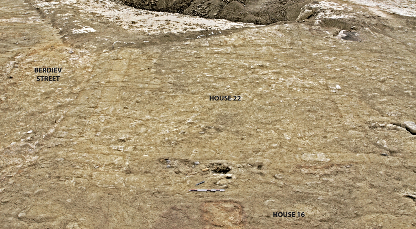 House 22 and a portion of House 16 as revealed by scraping. Both houses border directly on Berdiev Street. In the background is the backfilled Unit D.