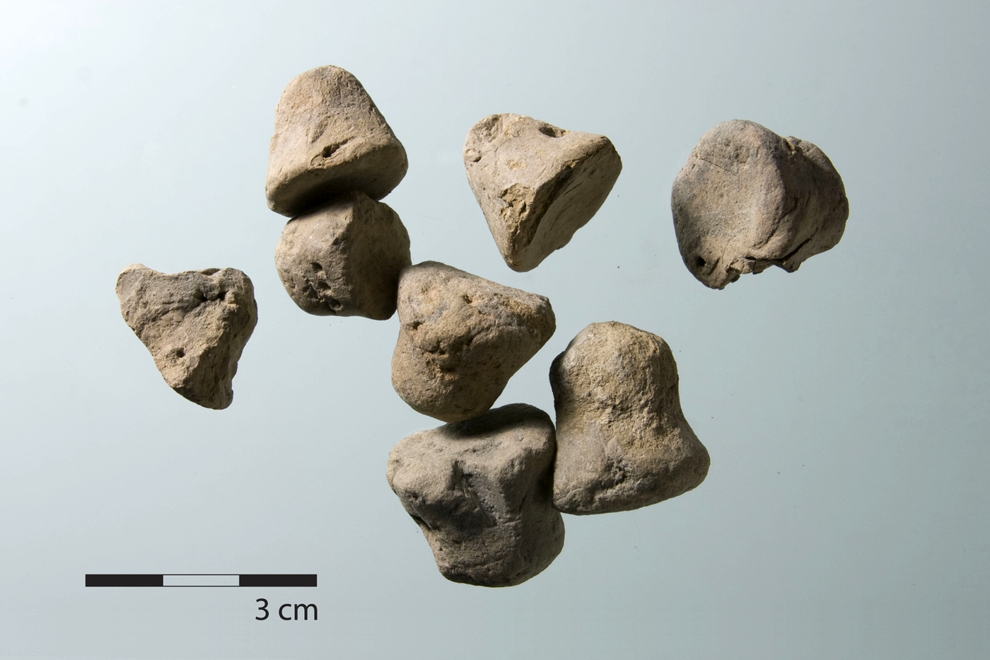 Squat and conical tokens from ash layers in House 2.
